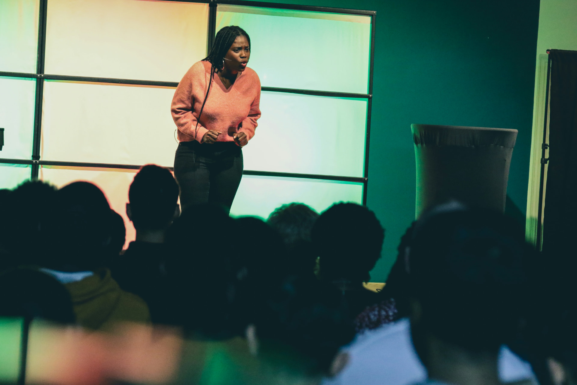 A speaker presenting to an audience of educators at a conference