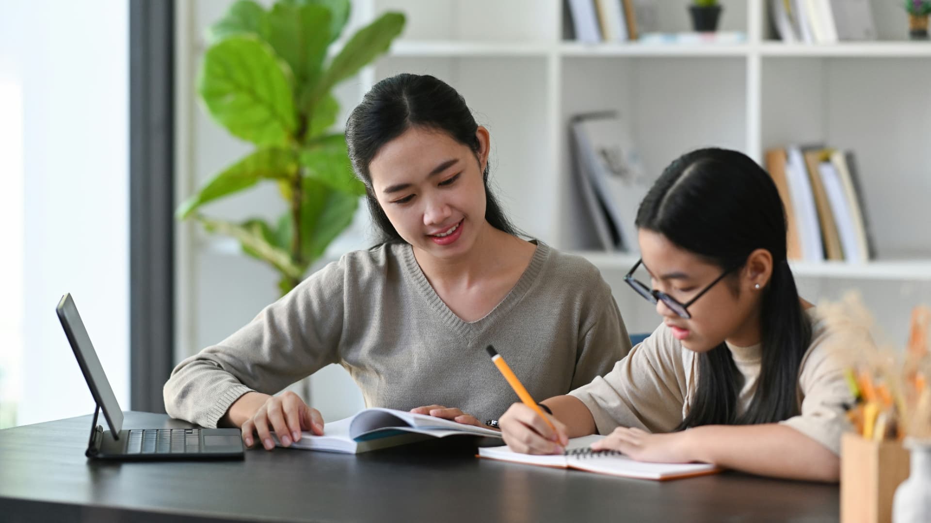 A specialist tutor working one-on-one with a young student